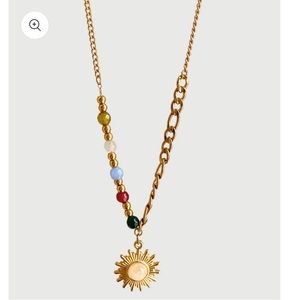 Beautiful sun necklace with multicolored beads. Brand new. Never been worn.